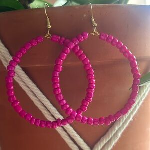 Three pairs of homemade (by me) beaded hoop earrings.